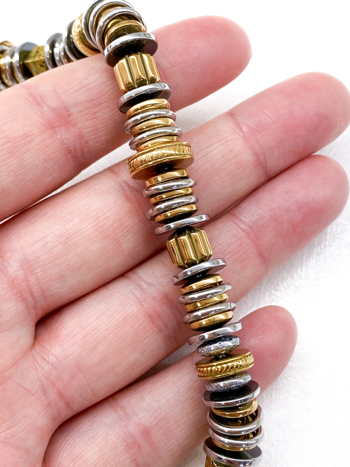 Bracelet femme en acier inoxydable doré et argenté aux formes graphiques