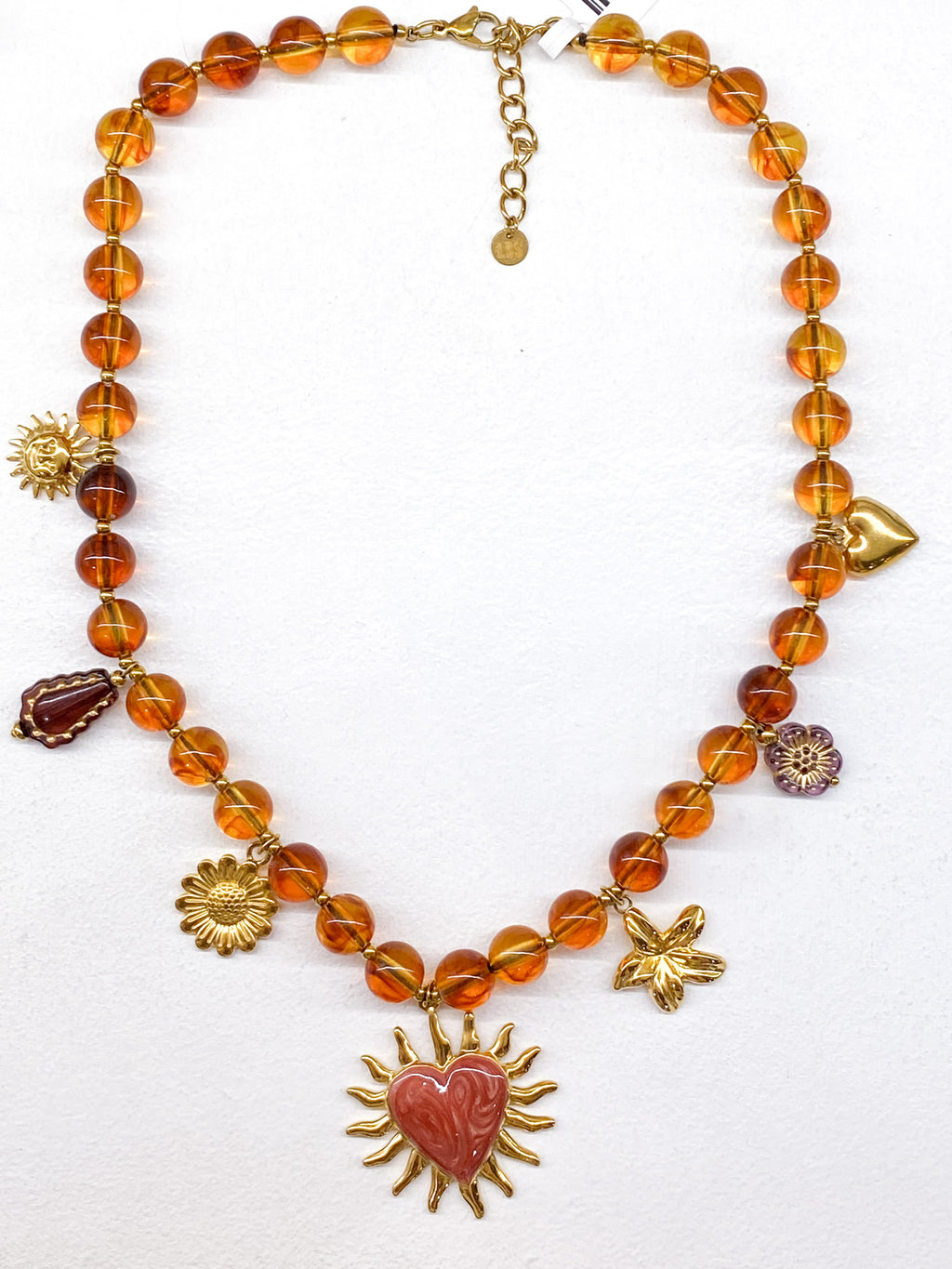 Collier femme à perles ambrées et pendentifs floraux