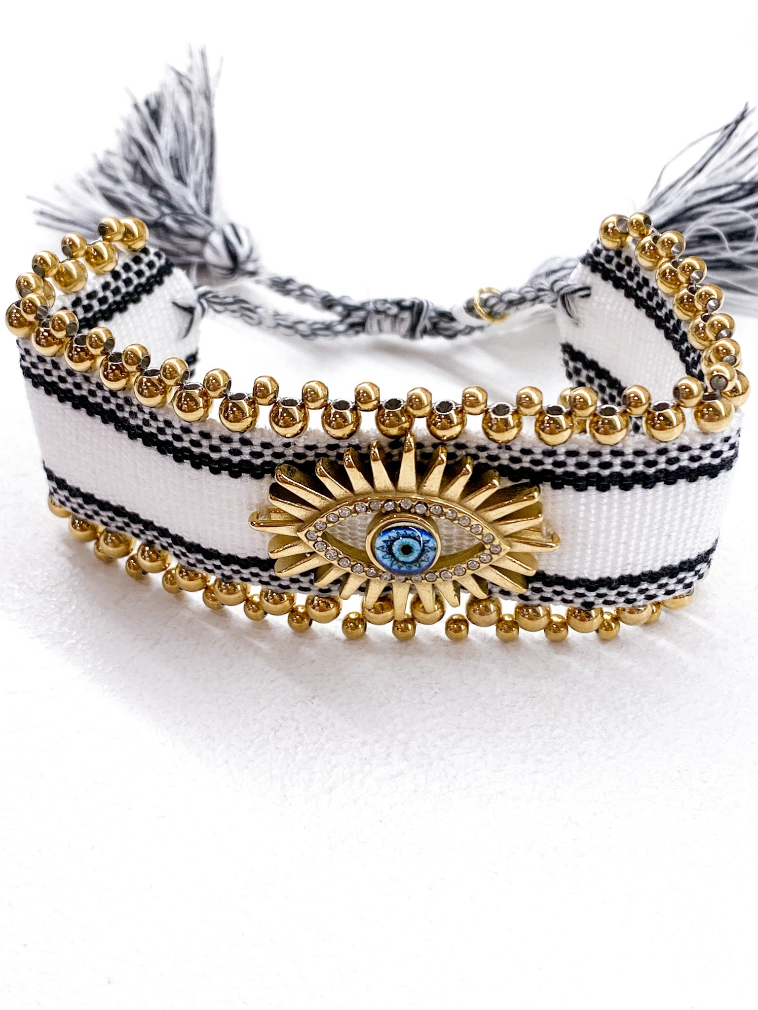 Bracelet femme large tressé avec œil grec et perles dorées