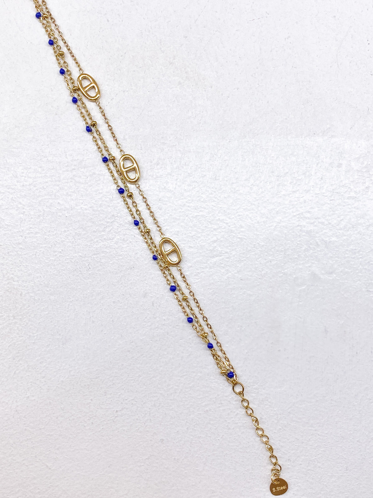 Bracelet fin doré multi-rangs à maillons et perles