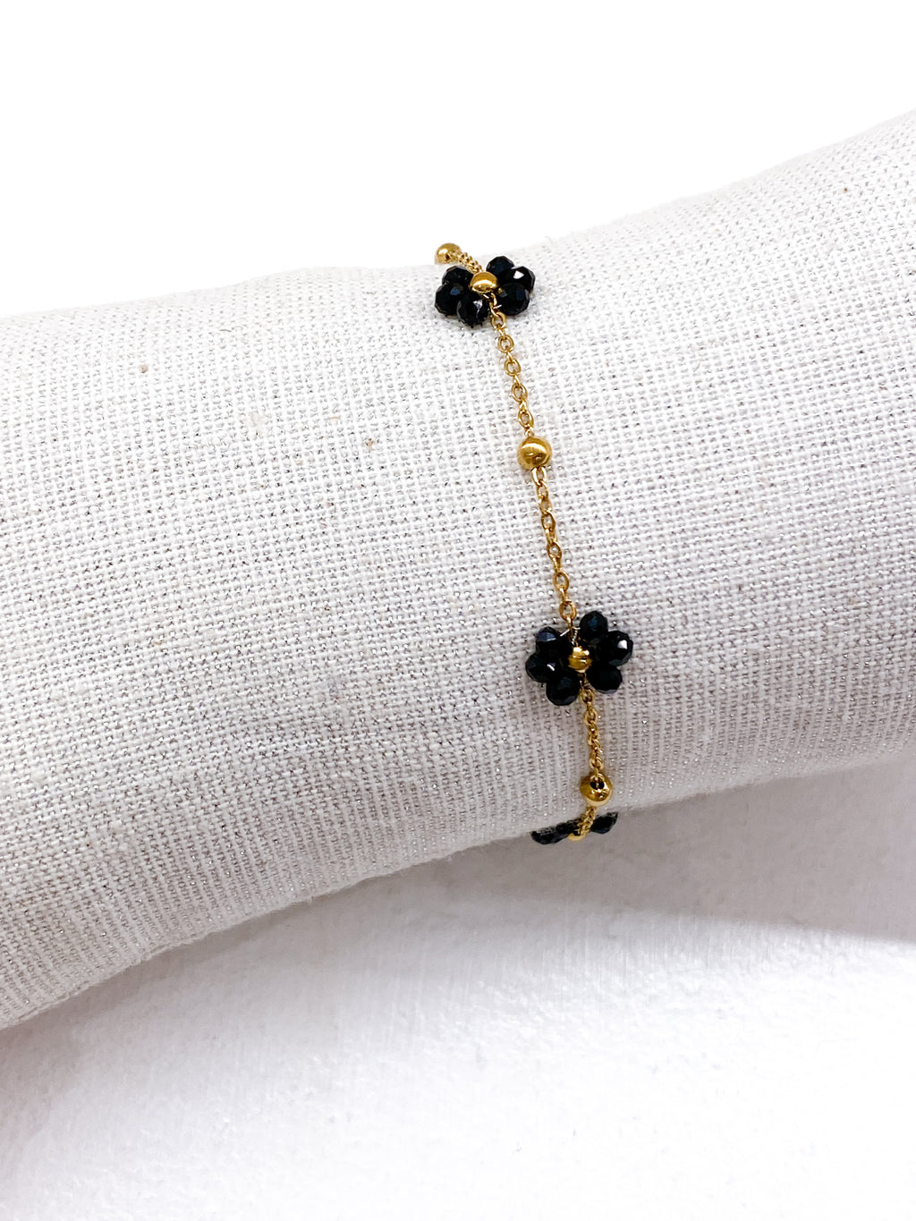 Bracelet fin fleurs noires en perles de verre