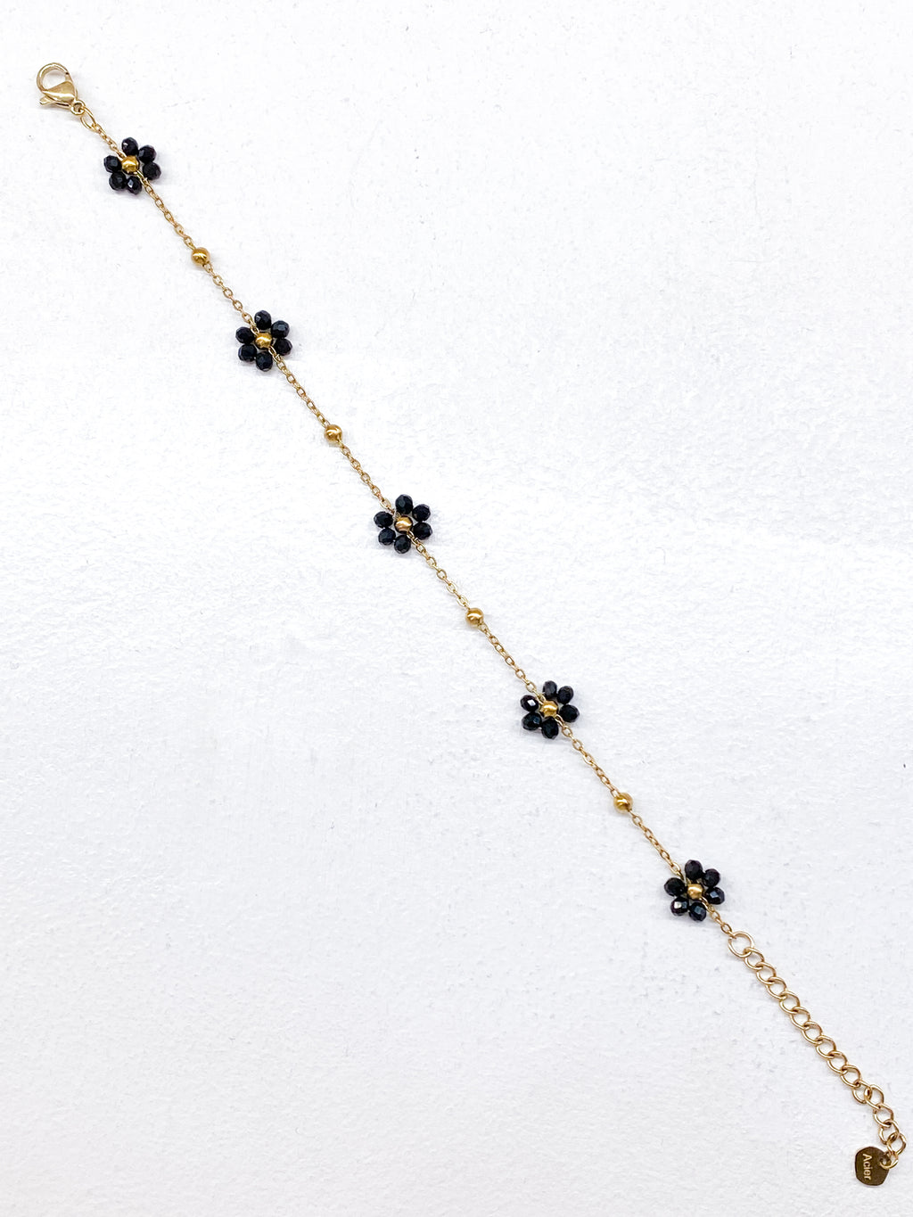 Bracelet fin fleurs noires en perles de verre