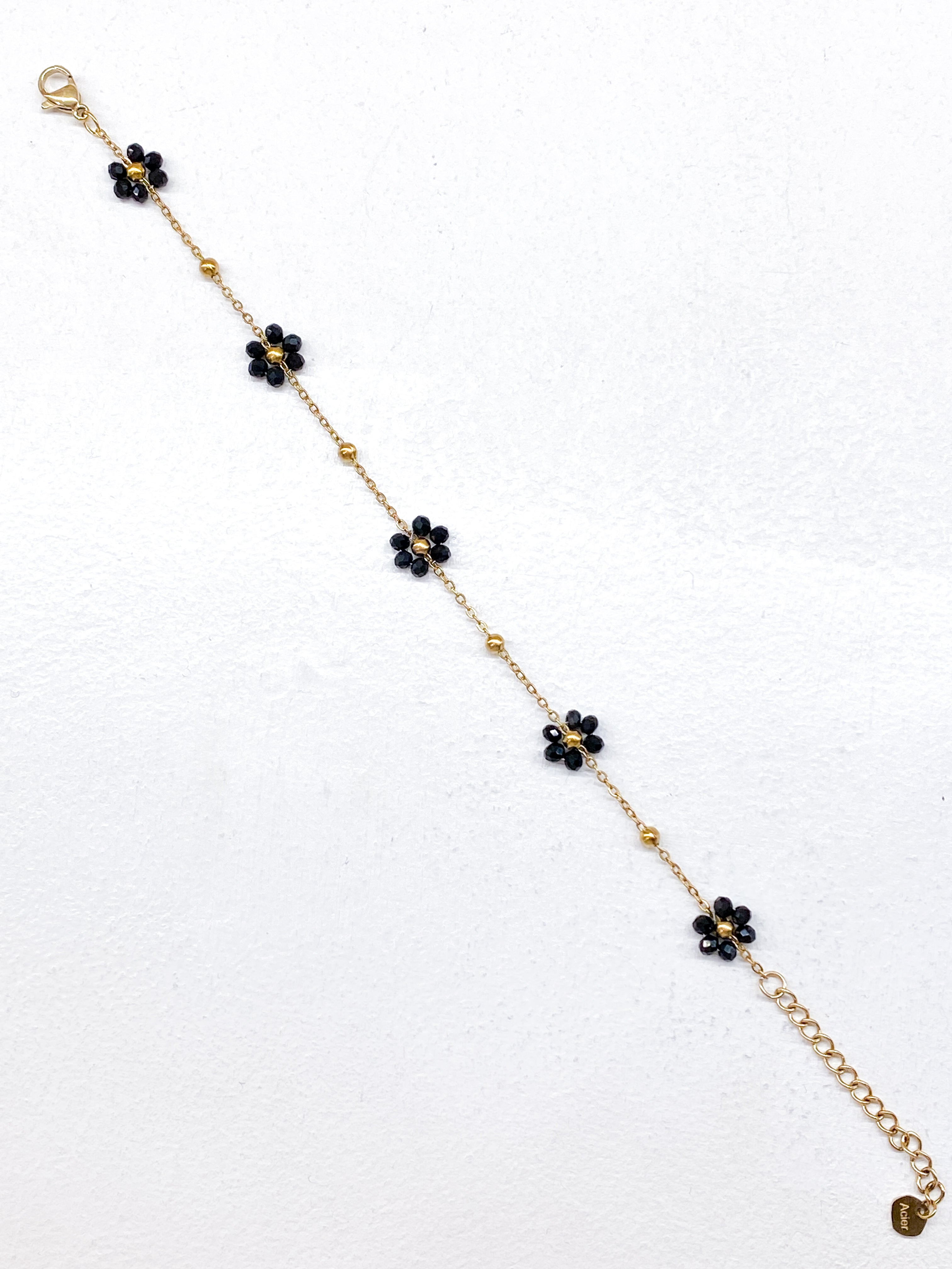 Bracelet fin fleurs noires en perles de verre
