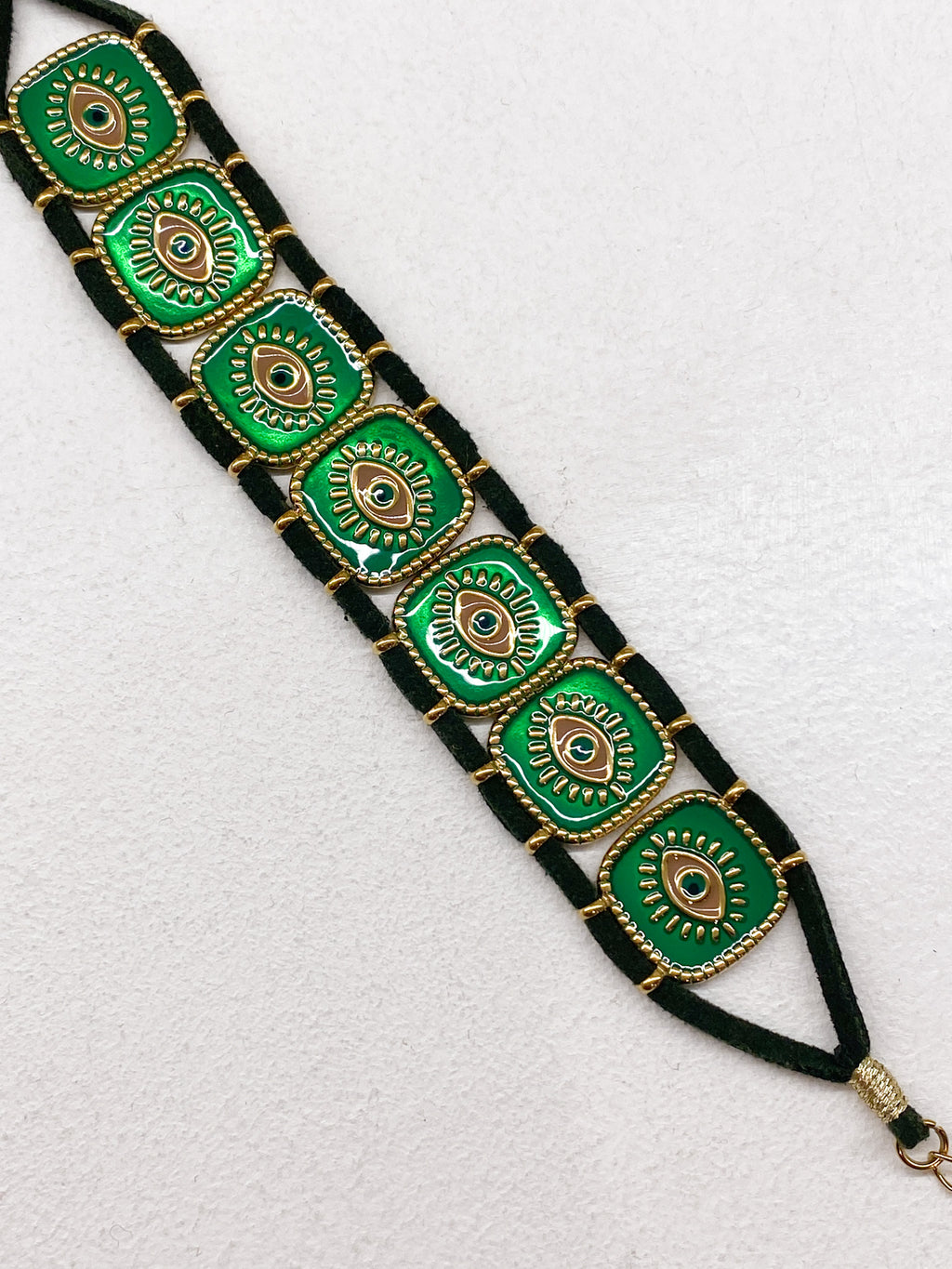 Bracelet en acier inoxydable doré avec carrés émaillés et œil grec
