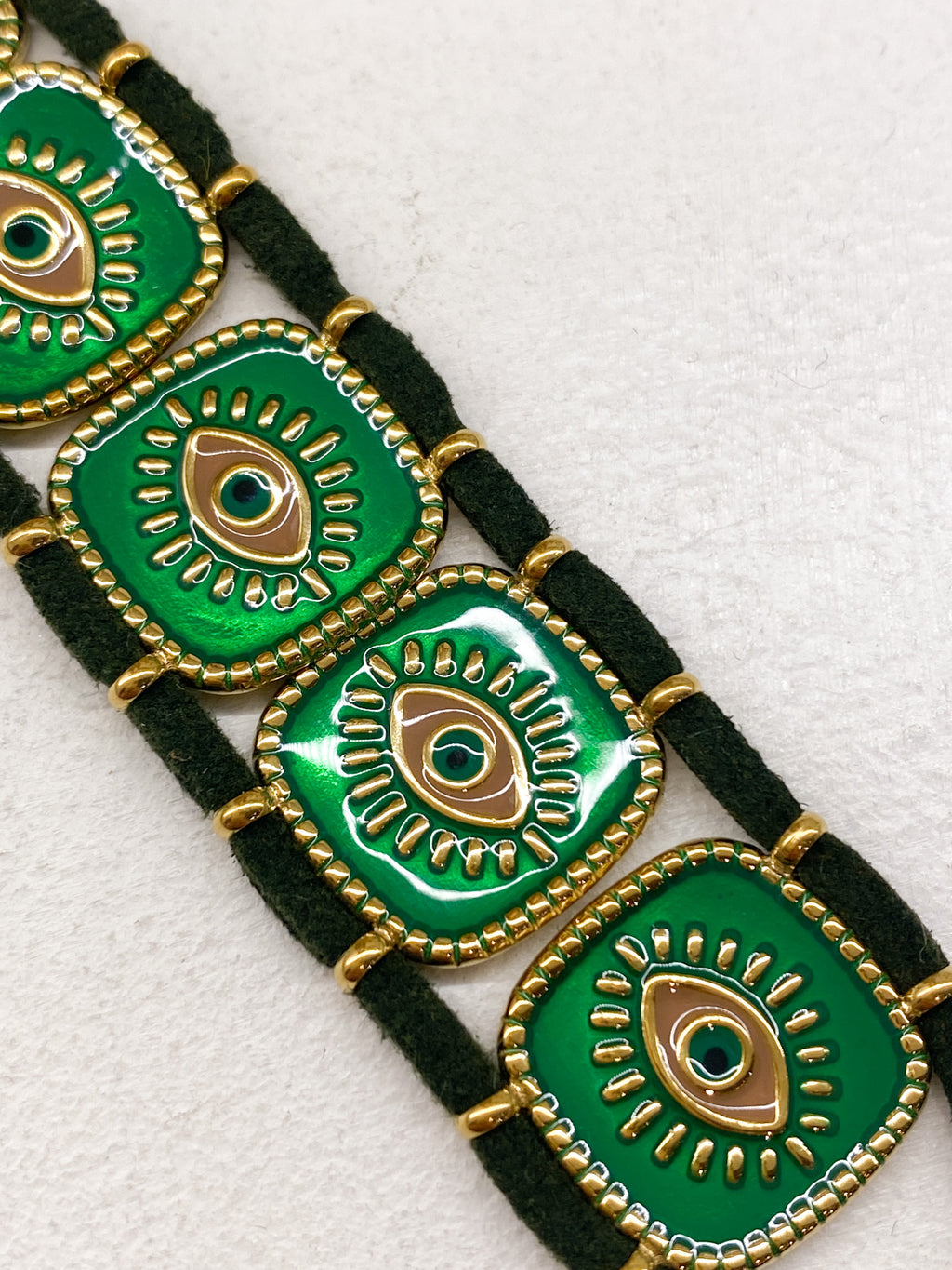 Bracelet en acier inoxydable doré avec carrés émaillés et œil grec