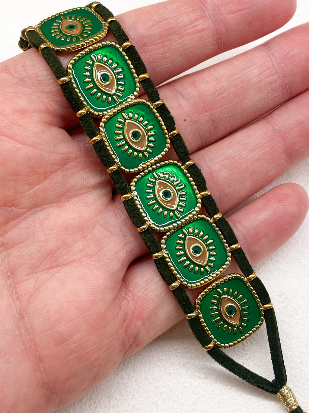 Bracelet en acier inoxydable doré avec carrés émaillés et œil grec