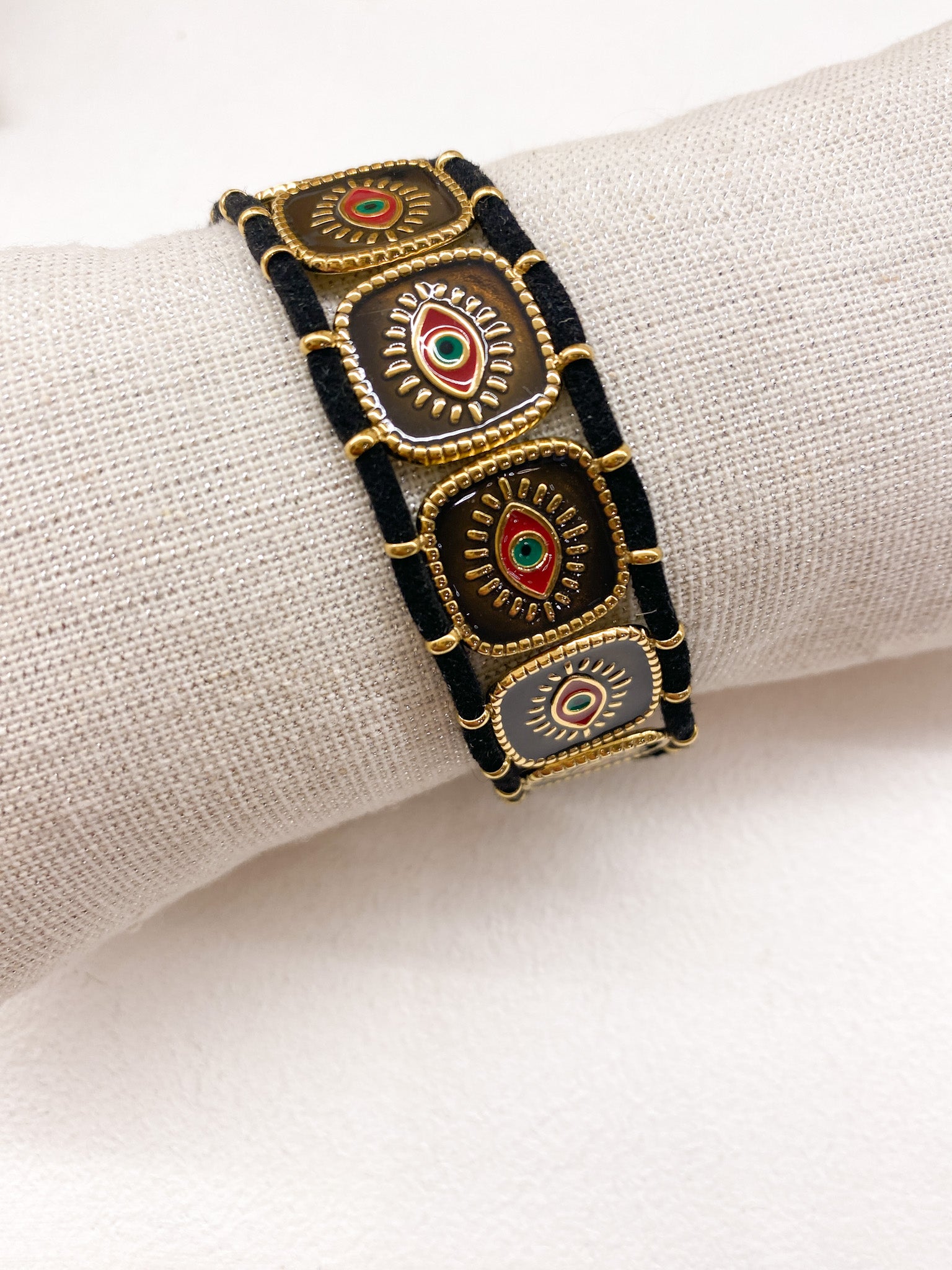 Bracelet en acier inoxydable doré avec carrés émaillés et œil grec