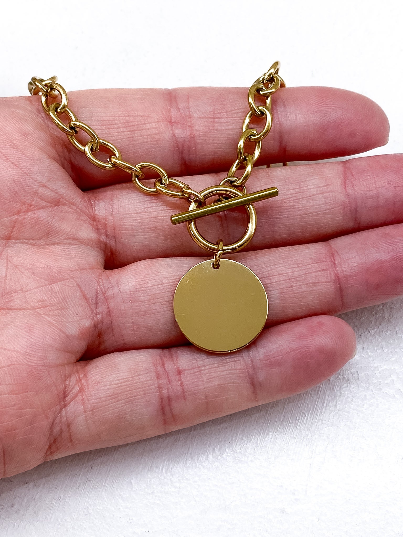 Collier chaîne épaisse avec médaillon rond