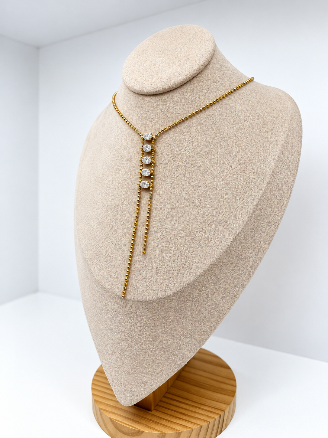 Collier Y doré asymétrique à strass brillants